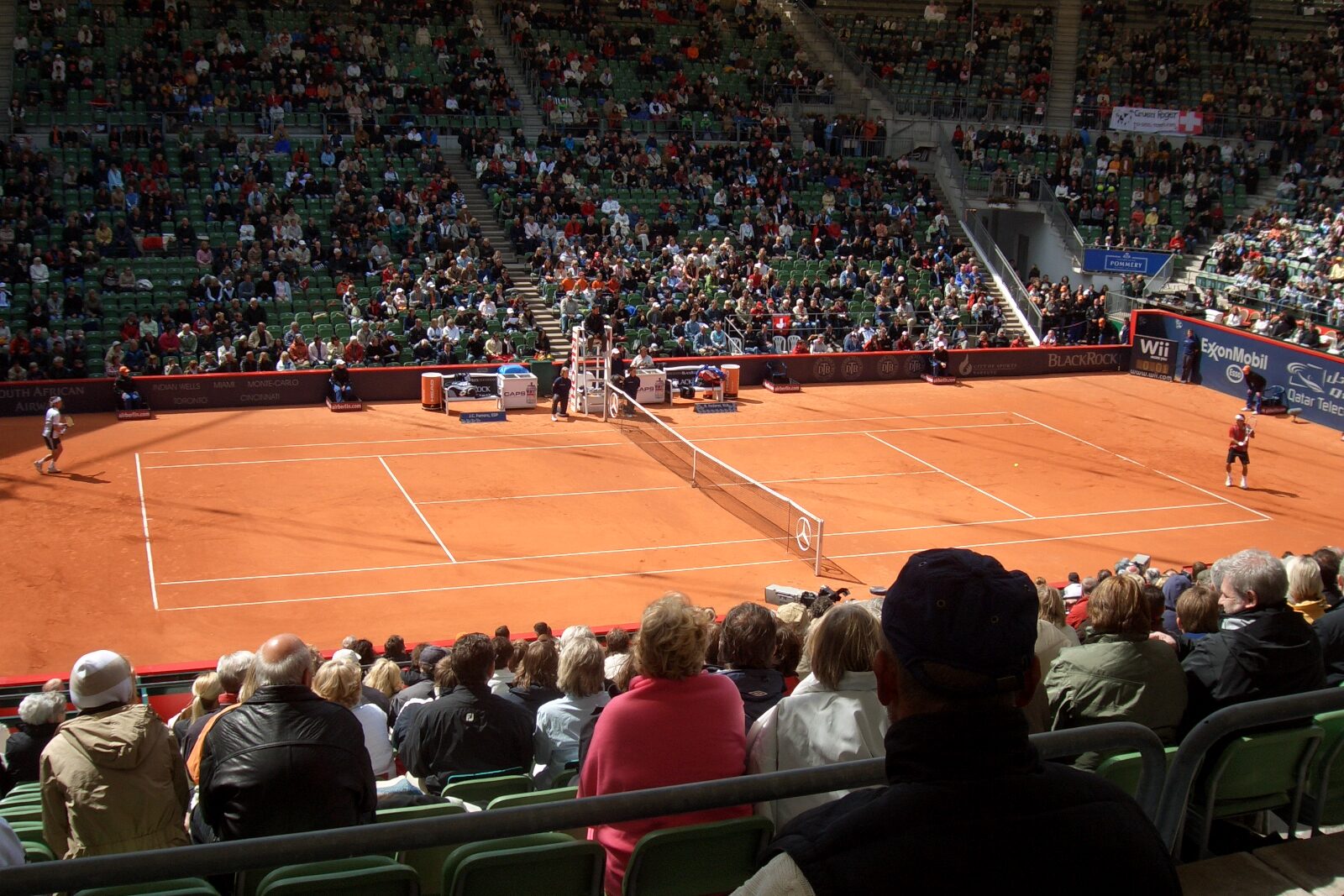 The centre court at the Rothenbaum, every seat taken, red clay, two players on the baselines